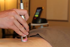 Laser Therapy being applied to Low Back